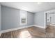 Bright bedroom with natural light, neutral walls, and hardwood floors, offering a serene retreat at 200 N Martin Luther King Jr N Ave, Salisbury, NC 28144