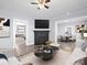 Bright living room with modern decor, fireplace, and seamless flow into dining area at 200 N Martin Luther King Jr N Ave, Salisbury, NC 28144