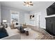 Inviting living room featuring fireplace, neutral tones, and ample natural light at 200 N Martin Luther King Jr N Ave, Salisbury, NC 28144