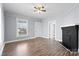 Cozy living room featuring a black fireplace and large windows at 200 N Martin Luther King Jr N Ave, Salisbury, NC 28144