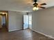 Inviting living room with wood floors, neutral walls, and a front door for easy access at 201 E Boston Ave, Bessemer City, NC 28016