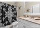 Bathroom featuring a black and white shower curtain, and tan countertops at 21311 Baltic Dr, Cornelius, NC 28031