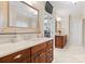 Bathroom featuring dual vanities with generous storage space and a walk-in closet at 21311 Baltic Dr, Cornelius, NC 28031