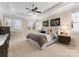 Spacious bedroom featuring trey ceilings, a ceiling fan and generous natural light at 21311 Baltic Dr, Cornelius, NC 28031