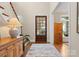 Elegant foyer featuring hardwood floors, a wood door, and views of the front yard at 21311 Baltic Dr, Cornelius, NC 28031