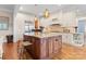 A spacious kitchen with custom cabinets, granite countertops, a large island, and stainless steel appliances at 21311 Baltic Dr, Cornelius, NC 28031
