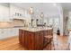 Spacious kitchen with a large island, granite countertops, pendant lighting, and white cabinets at 21311 Baltic Dr, Cornelius, NC 28031
