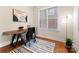 Cozy home office featuring hardwood floors, natural light, and stylish modern décor at 21311 Baltic Dr, Cornelius, NC 28031