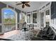 Inviting outdoor patio with scenic lake views, outdoor furniture, and a built-in grill at 21311 Baltic Dr, Cornelius, NC 28031