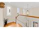 Bright foyer staircase with hardwood treads and large windows at 21311 Baltic Dr, Cornelius, NC 28031