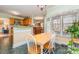 Charming breakfast nook with a wooden table set, chairs, and window views, perfect for morning meals at 2157 Mill House Ln, Matthews, NC 28104