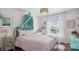 Charming bedroom with a decorative canopy bed, soft lighting, and a large window creating a cozy and inviting atmosphere at 2508 Shaggy Bark Ct, Belmont, NC 28012