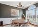 Elegant dining room features a large round table, chandelier, and bright window at 2508 Shaggy Bark Ct, Belmont, NC 28012