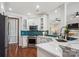 Modern kitchen with white cabinets, stainless steel appliances, and stylish backsplash at 2508 Shaggy Bark Ct, Belmont, NC 28012