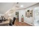 Bright office with skylight, built-in shelves, desk, and a view into the bathroom and bedroom at 2508 Shaggy Bark Ct, Belmont, NC 28012