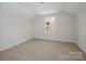Cozy bedroom with neutral carpet and a window providing natural light at 257 3Rd Se Ave, Hickory, NC 28602