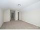 Bedroom with plush carpet, neutral walls, and closet at 257 3Rd Se Ave, Hickory, NC 28602