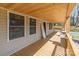 Inviting covered porch with wood ceiling and floor, offering a cozy outdoor space at 257 3Rd Se Ave, Hickory, NC 28602