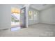 Inviting entryway with grey front door, wood-look flooring and lots of natural light at 257 3Rd Se Ave, Hickory, NC 28602