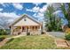 Picturesque home with a large front yard and covered porch, perfect for enjoying the outdoors at 257 3Rd Se Ave, Hickory, NC 28602