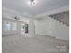 Spacious living room with neutral carpet, lots of windows, and an open floor plan at 257 3Rd Se Ave, Hickory, NC 28602