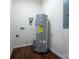 Utility room with hardwood-look flooring, water heater, and hookups at 257 3Rd Se Ave, Hickory, NC 28602