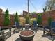 Private backyard featuring a charming fire pit area, perfect for outdoor entertaining and relaxation at 3301 Mountainbrook Rd, Charlotte, NC 28210