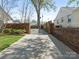 Gated driveway entrance flanked by brick walls, offering privacy and security at 3301 Mountainbrook Rd, Charlotte, NC 28210