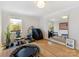 Home gym with wood floors, weights, exercise equipment, and natural light at 3301 Mountainbrook Rd, Charlotte, NC 28210