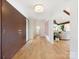 Bright hallway with light hardwood flooring and modern accents at 3301 Mountainbrook Rd, Charlotte, NC 28210