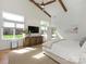 Bright main bedroom featuring exposed beam ceiling, large windows, and natural wood floors at 3301 Mountainbrook Rd, Charlotte, NC 28210