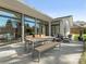 Outdoor patio with a dining table, modern lounge furniture and views of the backyard at 3301 Mountainbrook Rd, Charlotte, NC 28210