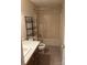 Modest bathroom featuring a combination bathtub/shower, toilet, and single vanity with storage shelving at 3748 Caribou Dr, Sherrills Ford, NC 28673