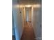 Long hallway with neutral walls and carpeted flooring, leading to various rooms at 3748 Caribou Dr, Sherrills Ford, NC 28673