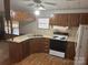 Classic kitchen with wooden cabinets, laminate countertops, and standard white appliances at 3748 Caribou Dr, Sherrills Ford, NC 28673