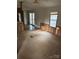 Spacious living room featuring a sliding glass door, large window and paneled wall at 3748 Caribou Dr, Sherrills Ford, NC 28673