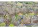 Aerial view showcasing the home's long driveway through lush, wooded acreage at 3772 Sandy Ford Rd, Hickory, NC 28602