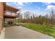 Outdoor patio with a covered deck overlooking a private, wooded backyard at 3772 Sandy Ford Rd, Hickory, NC 28602