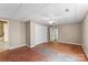 Large basement with white ceilings, beige walls, and outdated flooring at 3772 Sandy Ford Rd, Hickory, NC 28602