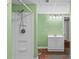 Bathroom featuring a shower stall and a white vanity, set against light green walls at 3772 Sandy Ford Rd, Hickory, NC 28602
