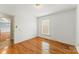 Cozy bedroom with hardwood floors and a view of the surrounding neighborhood at 3772 Sandy Ford Rd, Hickory, NC 28602