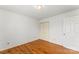 Simple bedroom featuring hardwood floors, a closet and an ensuite bathroom at 3772 Sandy Ford Rd, Hickory, NC 28602