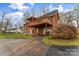 Back of house with a two-story wooden deck, concrete patio and driveway at 3772 Sandy Ford Rd, Hickory, NC 28602