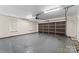 Clean, empty two car garage with sealed concrete floor and automatic door opener at 3772 Sandy Ford Rd, Hickory, NC 28602