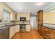 Well-lit kitchen with stainless appliances, granite countertops, tile backsplash and custom cabinetry at 3772 Sandy Ford Rd, Hickory, NC 28602