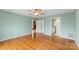 Spacious primary bedroom featuring hardwood floors, and ensuite bathroom at 3772 Sandy Ford Rd, Hickory, NC 28602