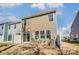 Backyard featuring a patio, sliding doors, and modern horizontal siding at 4241 Black Ct # 198, Harrisburg, NC 28075