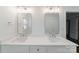 Elegant bathroom featuring double vanity with modern lighting and hardware at 4351 Woodglen Ln, Charlotte, NC 28226