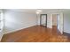 Expansive bedroom with hardwood floors, a ceiling fan, and ample natural light at 4351 Woodglen Ln, Charlotte, NC 28226