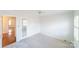 Carpeted bedroom with neutral colors, a ceiling fan, and a window with blinds at 4351 Woodglen Ln, Charlotte, NC 28226